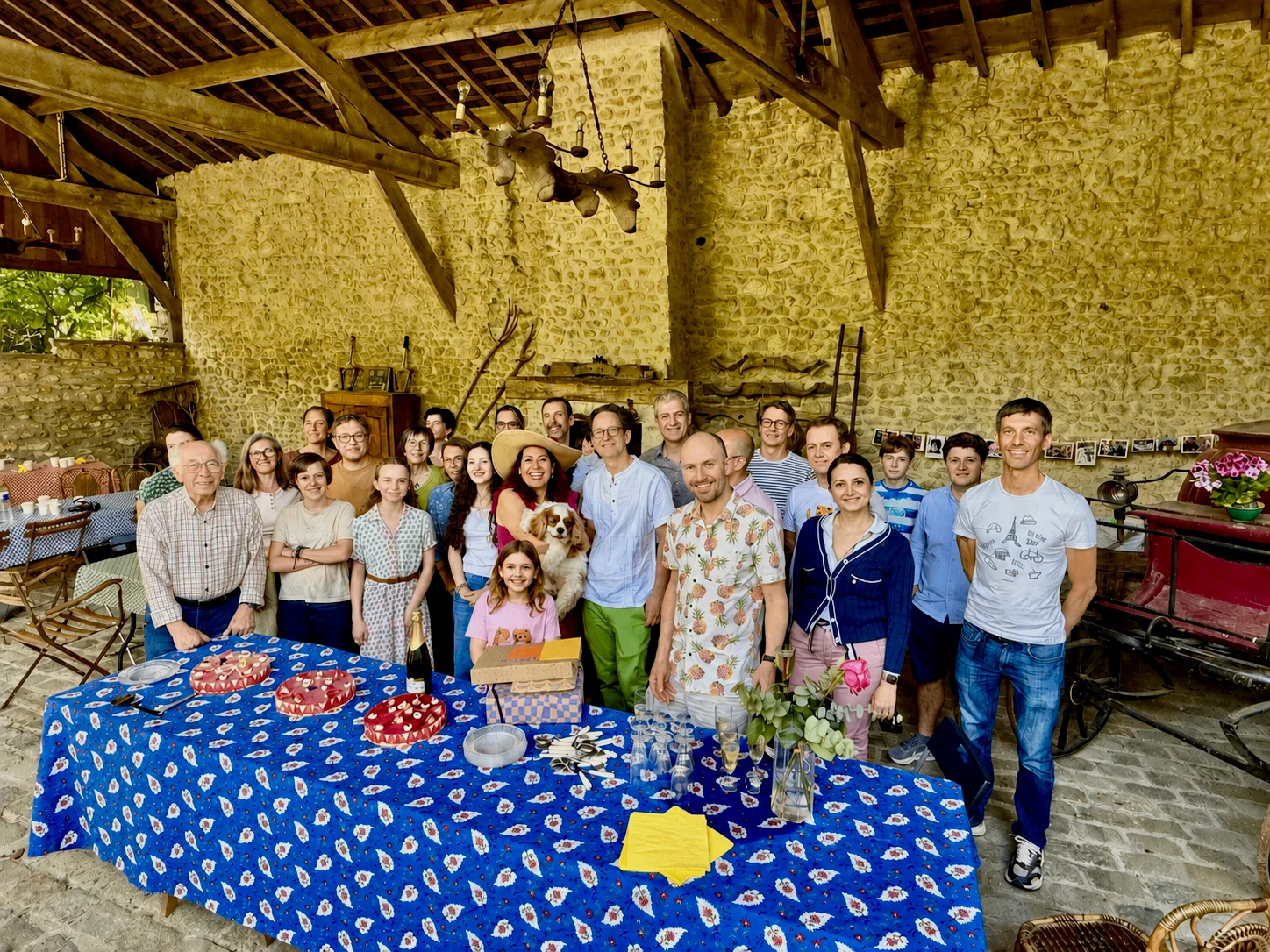 Family gathered for a celebration under La Grange at Moulin à Rêves