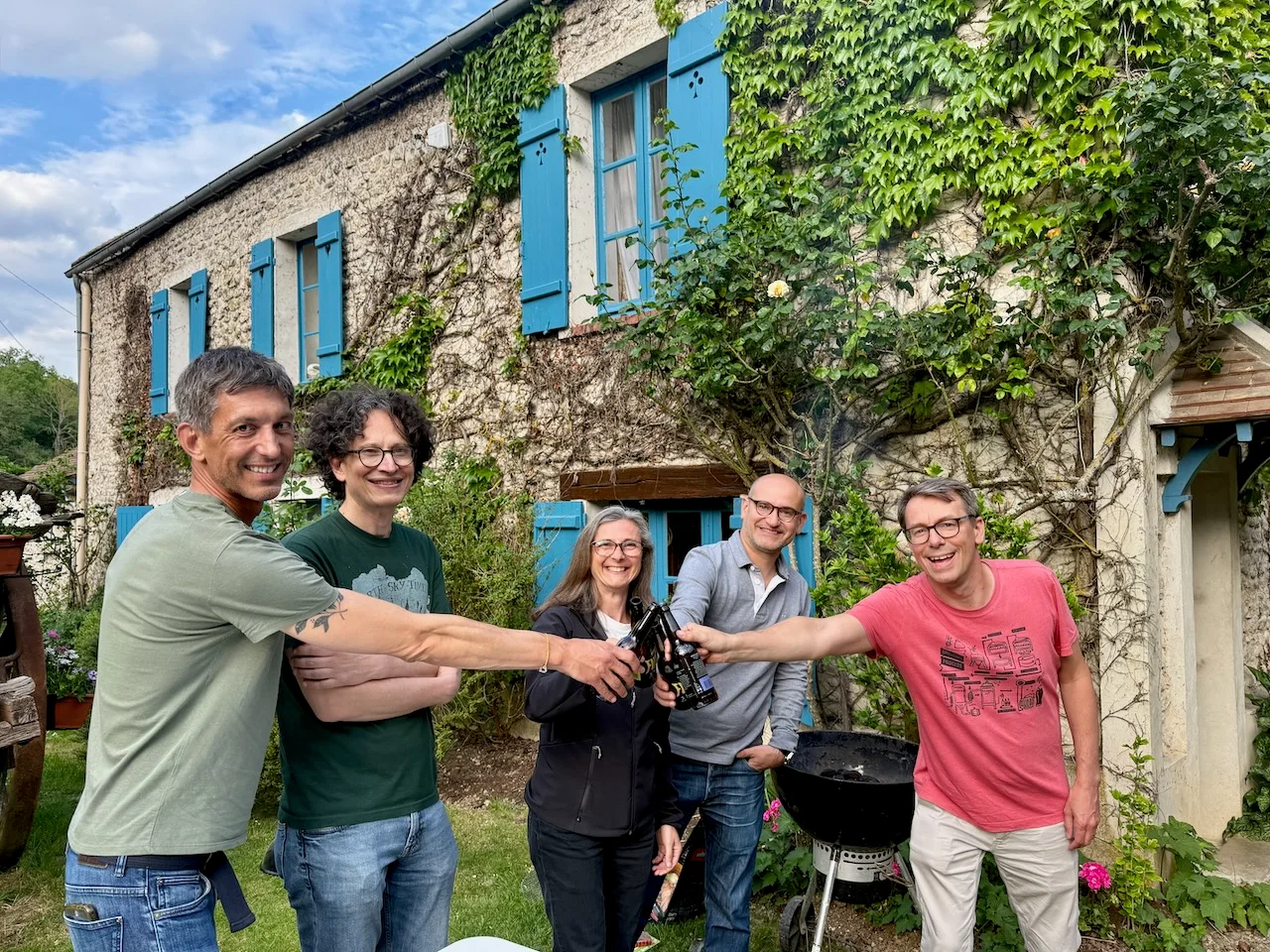 Friends raising a toast outside Hollywood Hideaway at Moulin à Rêves