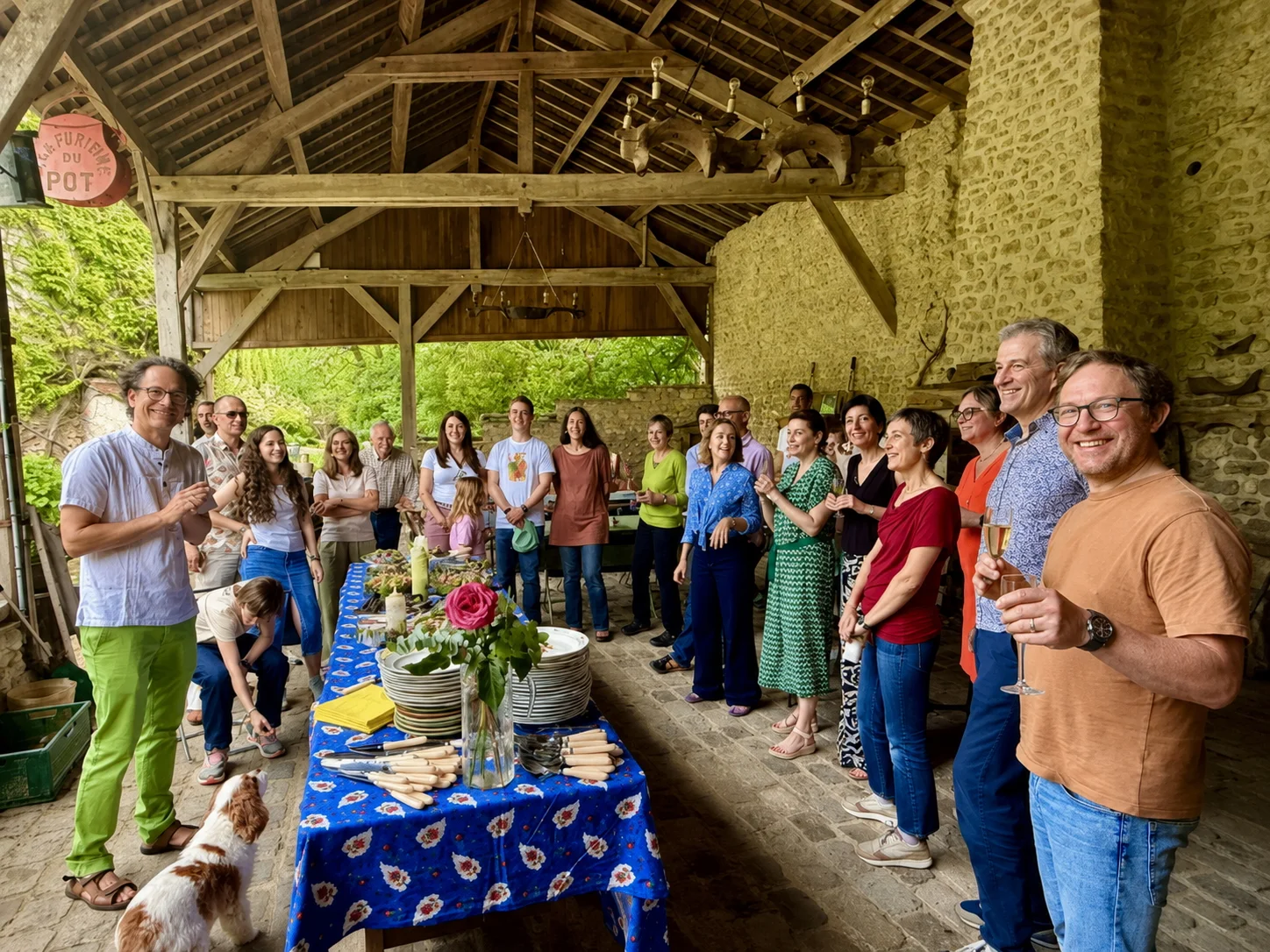 Guests gathered for a celebration beneath La Grange's covered pavilion at Moulin à Rêves