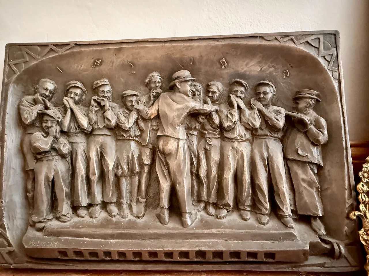 Bronze relief sculpture of Borrah Minevitch and the Harmonica Rascals