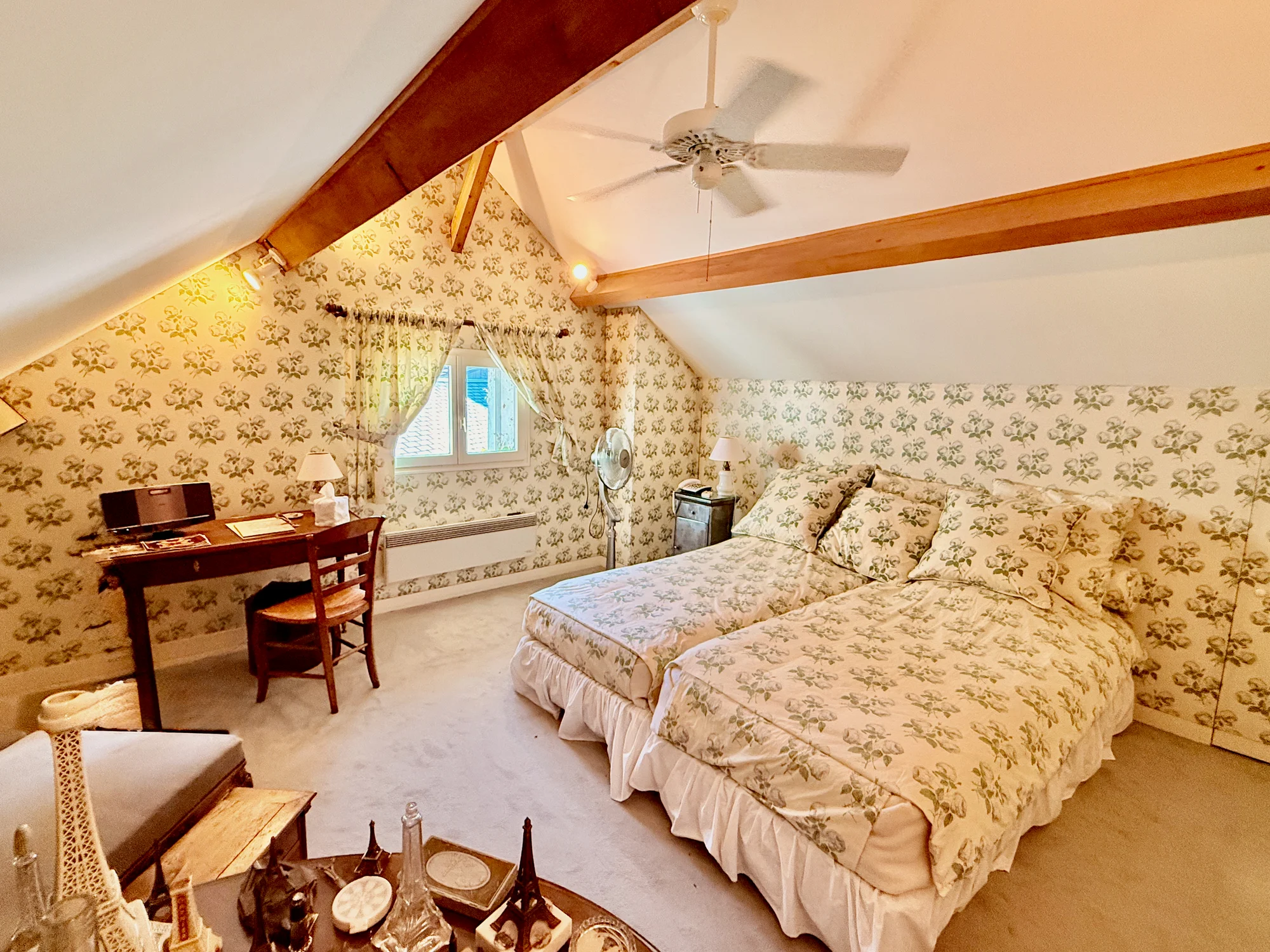 Le Loft Suite — master bedroom under cathedral ceilings
