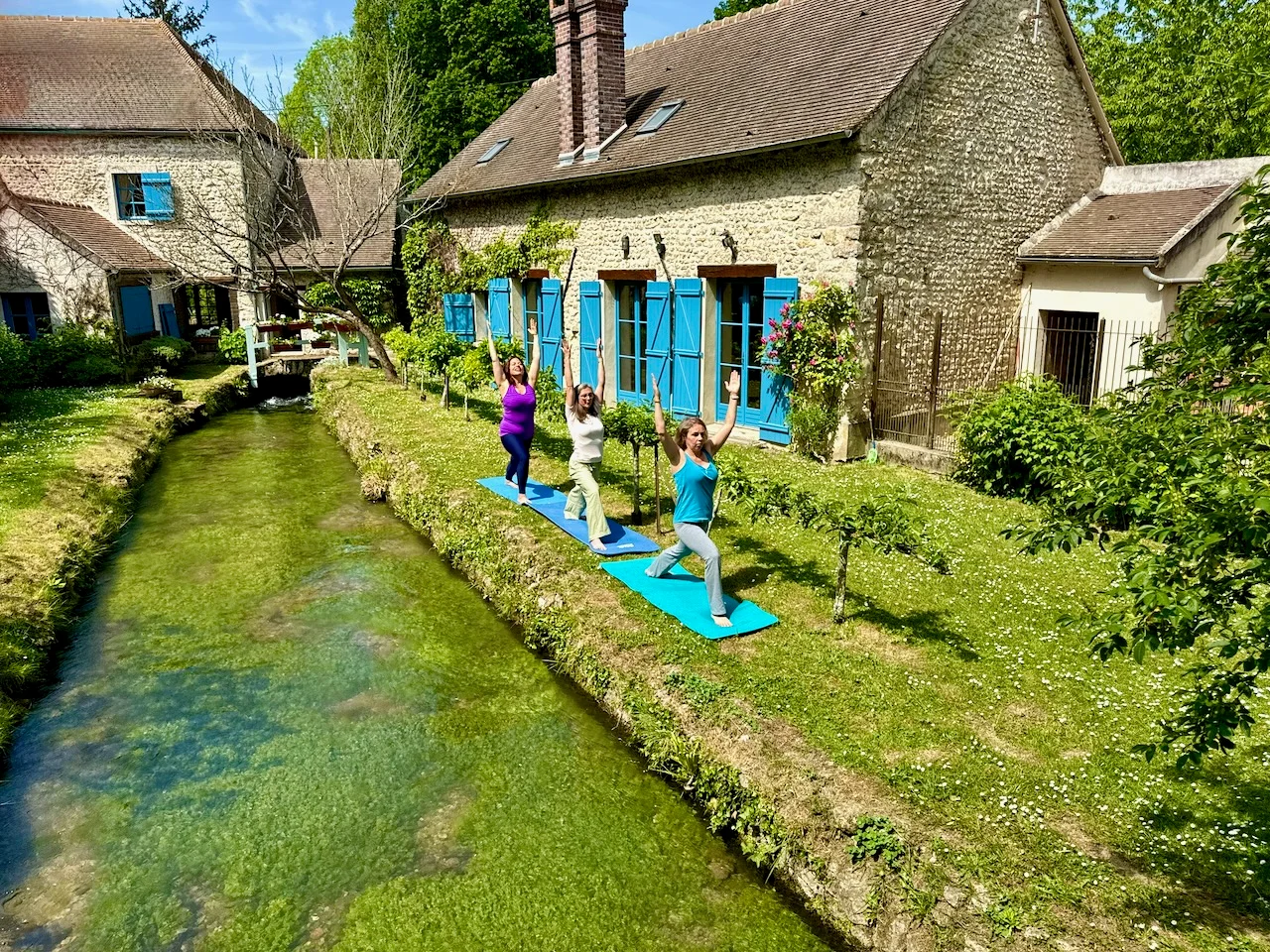 Yoga practice on the lawn beside the Hollywood Hideaway at Moulin à Rêves